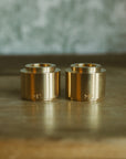 Box of two candle holders brass - FOLIES 1920