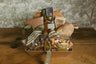 Gift basket with food items on a wooden surface