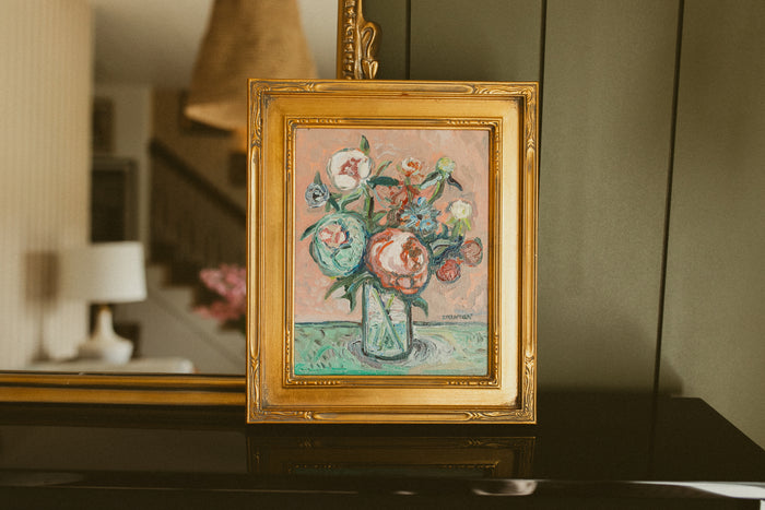 Original oil painting of a peony bouquet in a clear glass vase on a soft pink background by Chantry Brewer, in a carved gold frame