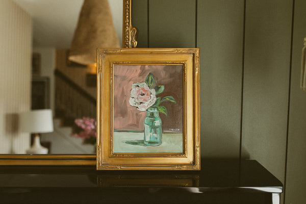Original oil painting of a cream garden rose in an aqua glass jar on a mauve background by Chantry Brewer, in a carved gold frame
