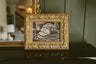 Original oil still life of a sliced rustic loaf on a wooden board by Chantry Brewer, in an ornate gold and cream frame