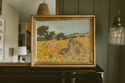 "Golden Harvest Field with Haystacks"