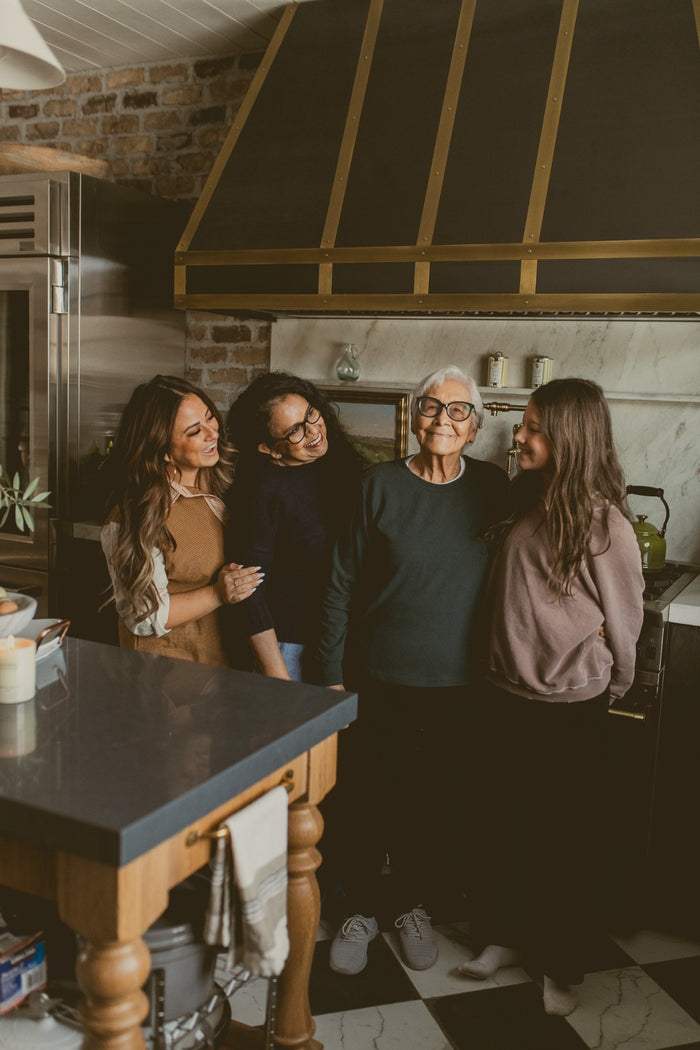 Family in kitchen cooking together
